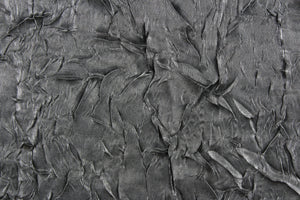 This taffeta fabric features a crinkle in iridescent dark gray.
