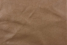 Load image into Gallery viewer, A vinyl fabric features a miniature brick design in a rich tan color.

