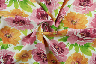 This multi use fabric features a large, floral design in shades of orange, pink and green on a white background.  It is perfect for outdoor settings or indoors in a sunny room.  It is stain and water resistant and can withstand up to 500 hours of direct sun exposure and has a durability rating of 10,000 double rubs.  Uses include decorative pillows, cushions, chair pads, tote bags and upholstery.