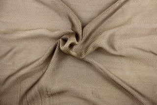 This sheer fabric features a curved line design in a metallic bronze.