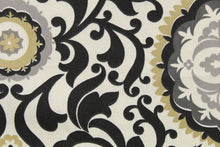 Load image into Gallery viewer, This fabric features an ornamental sun design in gray, white, taupe, and black .
