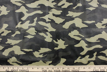 Load image into Gallery viewer, This vinyl fabric features a camouflage design in a green tones, black, and gray. 
