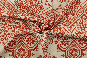  This fabric features a bohemian design in a dark orange and beige . 