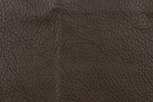 This vinyl fabric has a crackle design in a rich dark brown. 