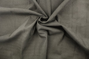 This fabric features a thin chevron design in gray and brown .