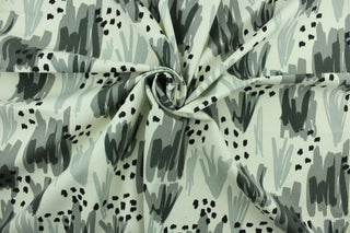 This fabric features an abstract design in gray, black and white.  It can be used for several different statement projects including window accents (drapery, curtains and swags), decorative pillows, hand bags, bed skirts, duvet covers, light duty upholstery and craft projects.  It has a soft workable feel yet is stable and durable.  We offer this design in several different colors.