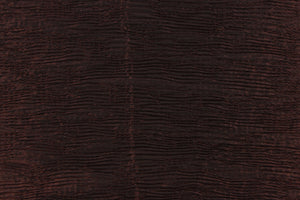 This taffeta fabric features a crinkle design in dark brown with black undertones . 
