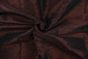 This taffeta fabric features a crinkle design in dark brown with black undertones . 