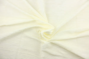 This taffeta fabric features a crinkle in cream. 