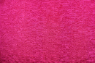 This taffeta fabric features a crinkle in rich dark pink.