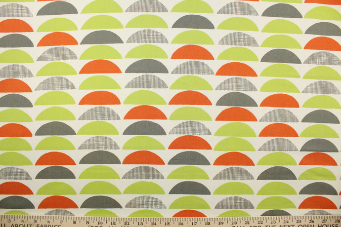 This fabric features various large scale half-circles screen printed on 100% cotton duck.  Colors included are lime green, orange, gray and off white.  The multi use fabric is perfect for window treatments, decorative pillows, custom cushions, bedding, light duty upholstery applications and almost any craft project.  This fabric has a soft workable feel yet is stable and durable with 50,000 double rubs.