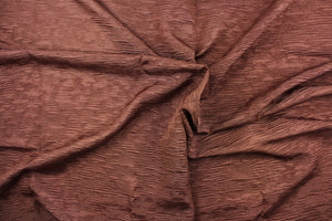 This taffeta fabric features a crinkle in brown. 