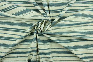 This fabric features stripes in indigo on a natural background.  It can be used for several different statement projects including window accents (drapery, curtains and swags), decorative pillows, hand bags, bed skirts, duvet covers, light duty upholstery and craft projects.  It has a soft workable feel yet is stable and durable.  We offer this design in several different colors.