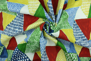 This multi use fabric features a geometrical design in red, blue, green, yellow and white.  It is perfect for outdoor settings or indoors in a sunny room.  It is stain and water resistant and can withstand up to 500 hours of direct sun exposure and has a durability rating of 10,000 double rubs.  Uses include decorative pillows, cushions, chair pads, tote bags and upholstery.