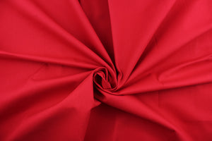  Poplin fabric in a solid red .