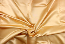 Load image into Gallery viewer,  A beautiful satin fabric in a gold color. 
