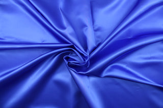 A beautiful satin fabric in a royal blue color. 