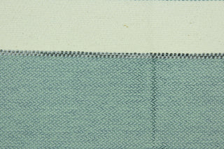 This hard wearing, textured yarn dyed fabric features a multi width  striped pattern in blue, grayish blue and ivory.  It is durable, strong and is water and stain resistant making it great for high traffic areas.  The latex backing makes it perfect for upholstery, decorative pillows, table runners, ottomans and tote bags.