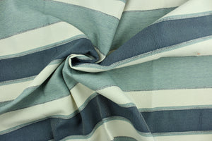This hard wearing, textured yarn dyed fabric features a multi width  striped pattern in blue, grayish blue and ivory.  It is durable, strong and is water and stain resistant making it great for high traffic areas.  The latex backing makes it perfect for upholstery, decorative pillows, table runners, ottomans and tote bags.