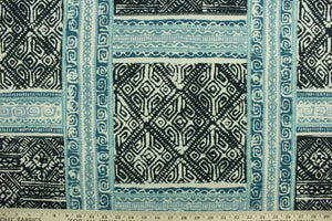 Luiza is a versatile medium/heavyweight fabric featuring an Aztec design in indigo, teal, grayish blue and ivory.  It can be used for several different statement projects including window accents (drapery, curtains and swags), decorative pillows, hand bags, bed skirts, duvet covers, light duty upholstery and craft projects.  It has a durability rating of 15,000 double rubs.