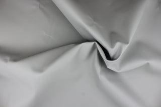 A vinyl fabric in a smooth gray. 