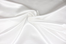 Load image into Gallery viewer, A beautiful satin fabric in a bright white color.
