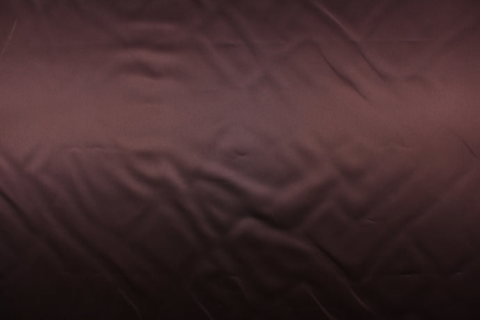 A beautiful satin fabric in a rich chocolate brown color.