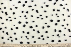 This faux fur features a dot design in black against white. 