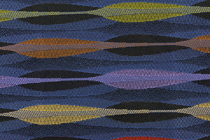 This fabric features a geometric  design in purple, orange, green, golden tan, black, and blue.