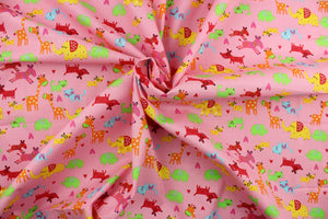Menagerie is a bright animal print that features giraffes, elephants, zebras, dogs and cats. The versatile lightweight fabric is soft and easy to sew.  It would be great for quilting, crafting and sewing projects.  Colors included are orange, green, red, yellow, blue and pink.