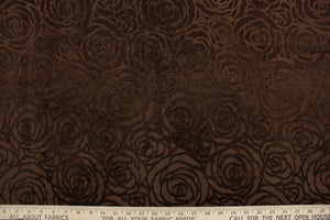  An upholstery velvet featuring a floral design in a true brown  . 