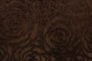  An upholstery velvet featuring a floral design in a true brown  . 