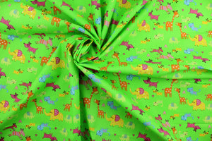  Menagerie is a bright animal print that features giraffes, elephants, zebras, dogs and cats. The versatile lightweight fabric is soft and easy to sew.  It would be great for quilting, crafting and sewing projects.  Colors included are orange, green, yellow, blue and pink.  We offer this print in other colors.