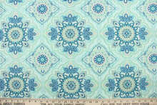 Load image into Gallery viewer, This outdoor fabric features a medallion design in blues, beige, white, turquoise, mint green, and pale green . 
