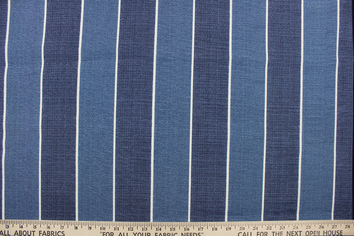 This outdoor print features a stripe design in shades of blue and white. 
