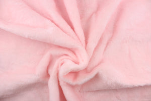 A faux fur in a solid light pink.