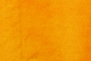  A faux fur in a solid bright yellow with orange undertones.