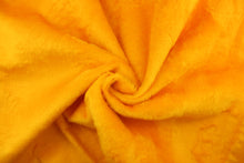 Load image into Gallery viewer,  A faux fur in a solid bright yellow with orange undertones.
