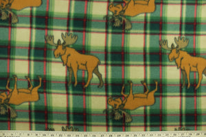 This ultra soft, medium weight printed fleece is the go to fabric for warmth.  The green, red and taupe plaid features a brown elk and is perfect for creating jackets, vests, scarves, gloves, throws, bedding and more!  We offer this design in other colors.