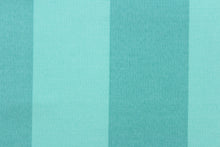 Load image into Gallery viewer,  This fabric outdoor features a stripe design in shades of turquoise. 
