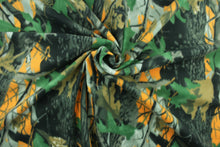 Load image into Gallery viewer, This ultra soft, medium weight printed fleece is the go to fabric for warmth.  The camouflage design in the colors of green, black, gray, brown and orange is perfect for creating jackets, vests, scarves, gloves, throws, bedding and more!  We offer this design in one other color.
