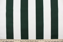 Load image into Gallery viewer, This indoor/outdoor fabric in dark green and white stripes is perfect for any project where the fabric will be exposed to the weather.
