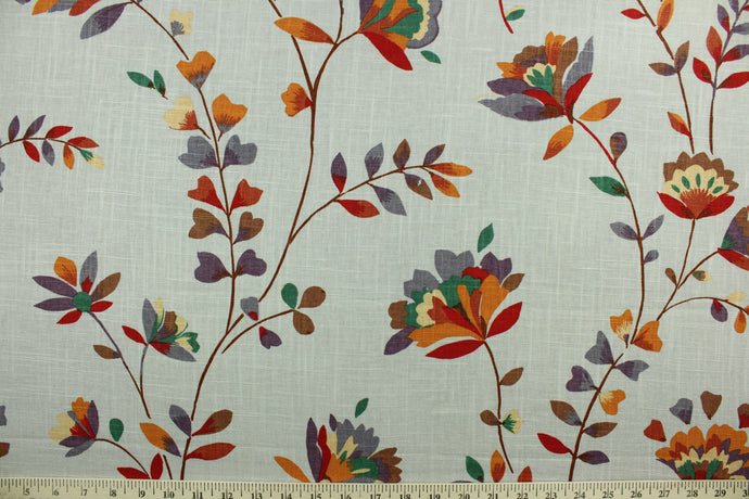 Pirovette is a multi use fabric featuring a floral design in green, red, purple, brown, beige and orange against a stone gray background.  It can be used for several different statement projects including window accents (drapery, curtains and swags), decorative pillows, hand bags, bed skirts, duvet covers, upholstery and craft projects.  It has a soft workable feel yet is stable and durable.