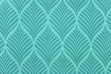 Load image into Gallery viewer, This outdoor fabric features a leaf design in shades of teal green. 
