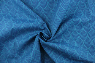  This outdoor fabric features a leaf design in shades of blue.