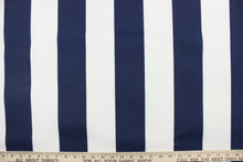 Load image into Gallery viewer,  This indoor/outdoor fabric in navy blue and white stripes is perfect for any project where the fabric will be exposed to the weather. 
