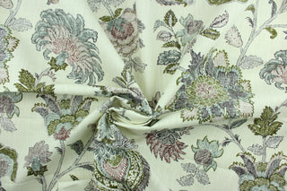 This fabric features a large print floral design in green, blue and purple on a cream background.  It is waterproof and would be great for drapery or shower curtains.  It has a stiff feel but easy to work with.