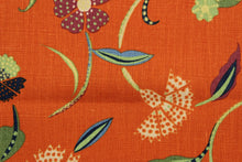 Load image into Gallery viewer,  Jacobean features a floral vine design in navy blue, powder blue, green, gold and magenta against a cinnamon background.  It can be used for several different statement projects including window accents (drapery, curtains and swags), decorative pillows, hand bags, bed skirts, duvet covers, upholstery and craft projects.  It has a soft workable feel yet is stable and durable with 30,000 double rubs. 
