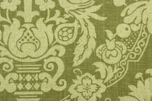 Load image into Gallery viewer, This multi purpose fabric features a a damask design in beige and olive green.  It can be used for several different statement projects including window accents (drapery, curtains and swags), decorative pillows, hand bags, bed skirts, duvet covers, upholstery and craft projects.  It has a soft workable feel yet is stable and durable.
