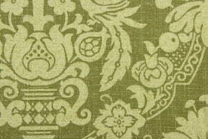 This multi purpose fabric features a a damask design in beige and olive green.  It can be used for several different statement projects including window accents (drapery, curtains and swags), decorative pillows, hand bags, bed skirts, duvet covers, upholstery and craft projects.  It has a soft workable feel yet is stable and durable.